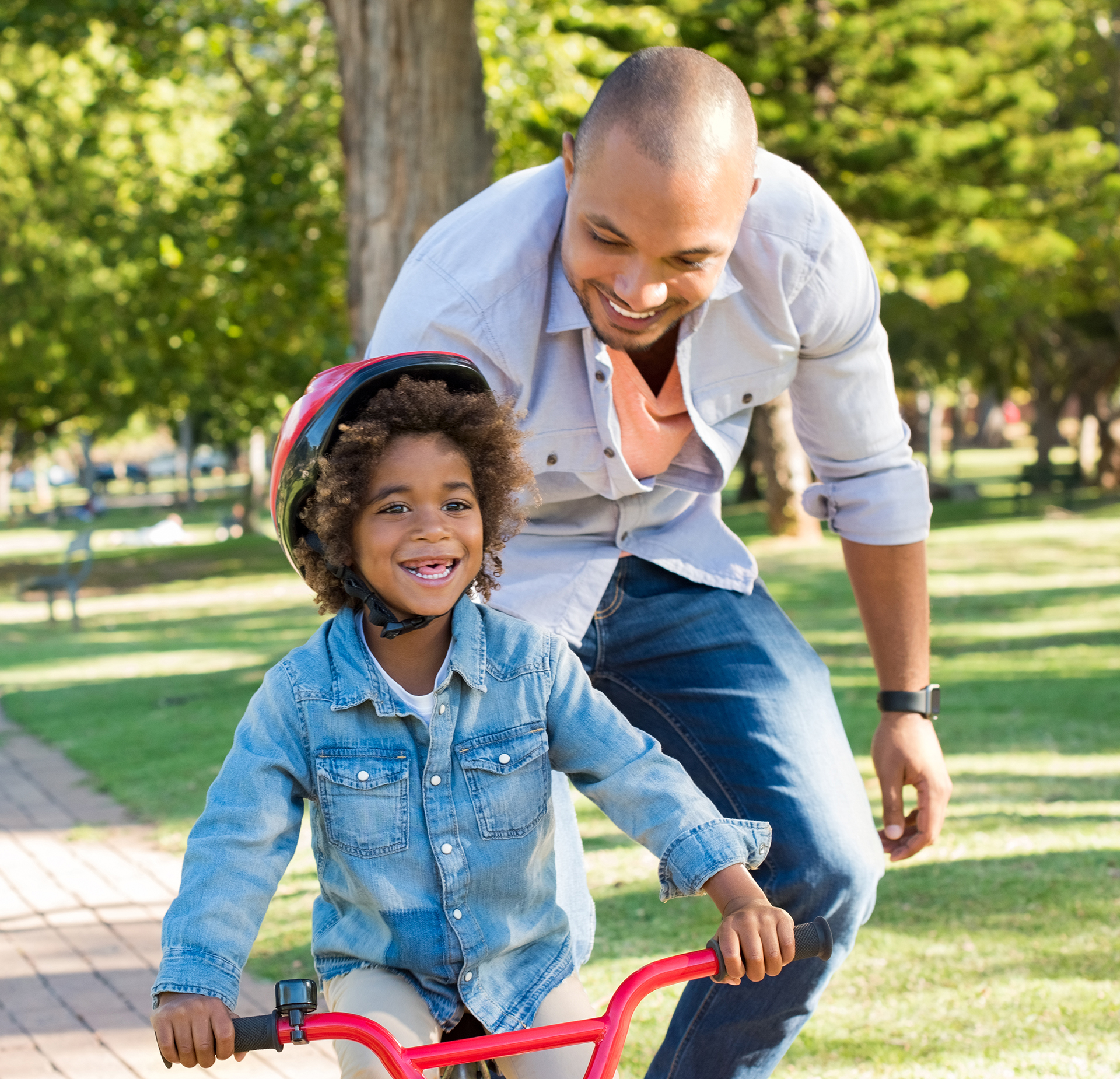 Father teaching son cycling smart neighborhood